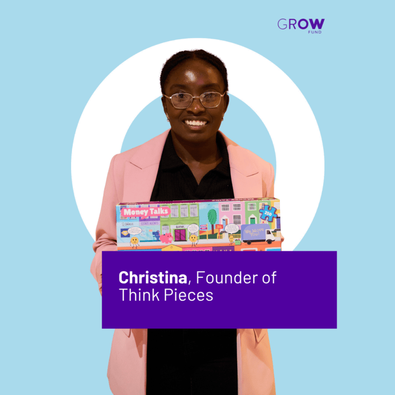 Christina, Founder of Think Pieces, is stood smiling holding a Think Pieces board game.