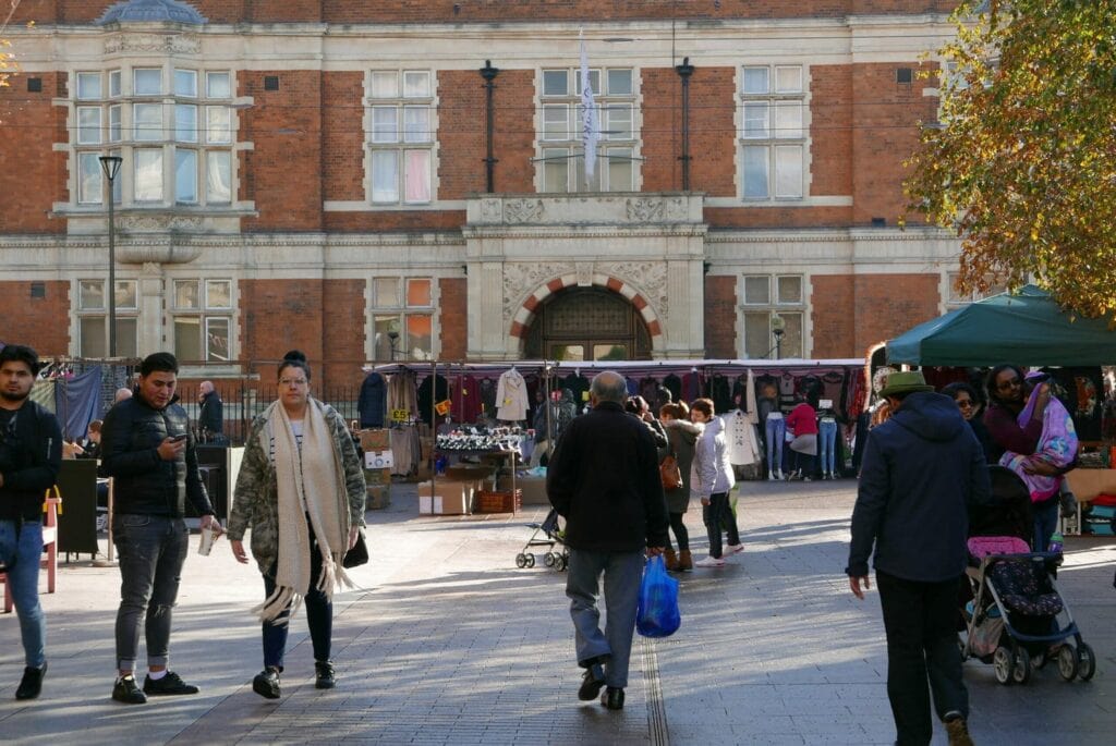 People walking through Barking market